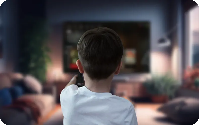 Child using a remote control to access streaming content on a smart TV with IBO Player